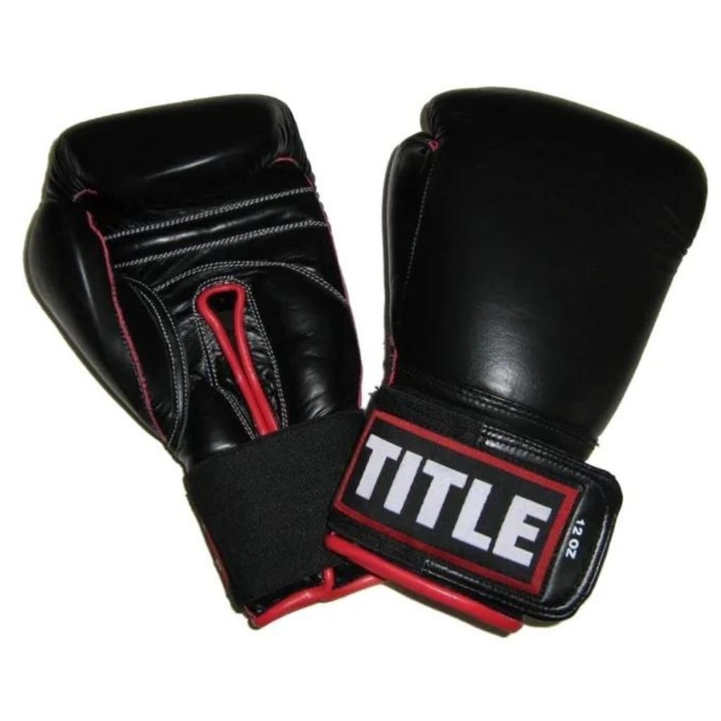 The TITLE Leather Sparring Gloves offer 100% full-leather durability, multi-layer shock-absorbing foam, and a secure hook-and-loop wrist strap for training.