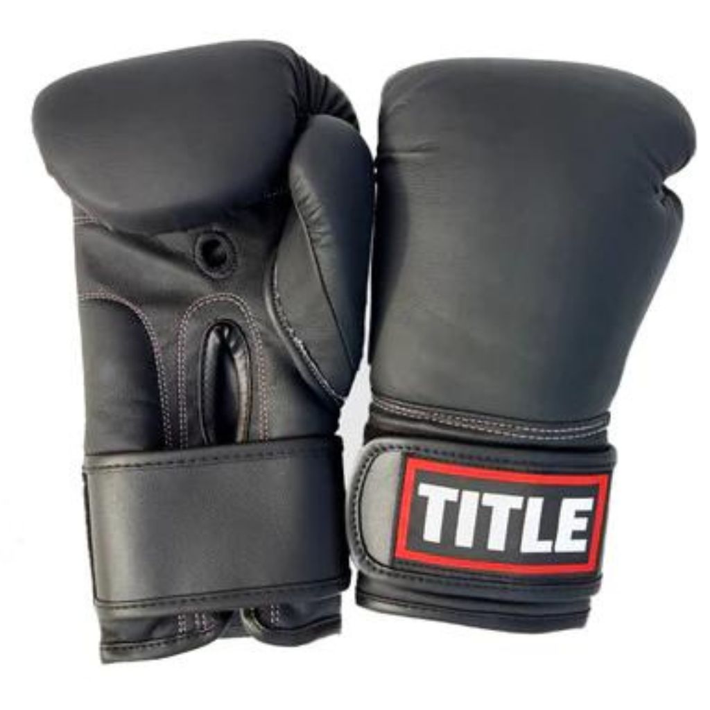 The TITLE Powerhide Sparring Gloves feature durable synthetic leather, multi-layer shock-absorbing foam, and a full wrap-around wrist strap for secure sparring.